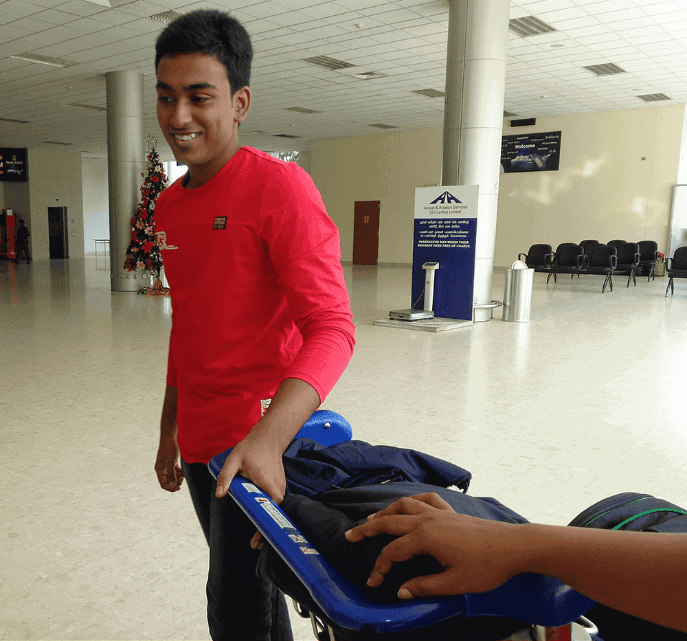 Alston at Sri Lankan airport before departing for master studies.