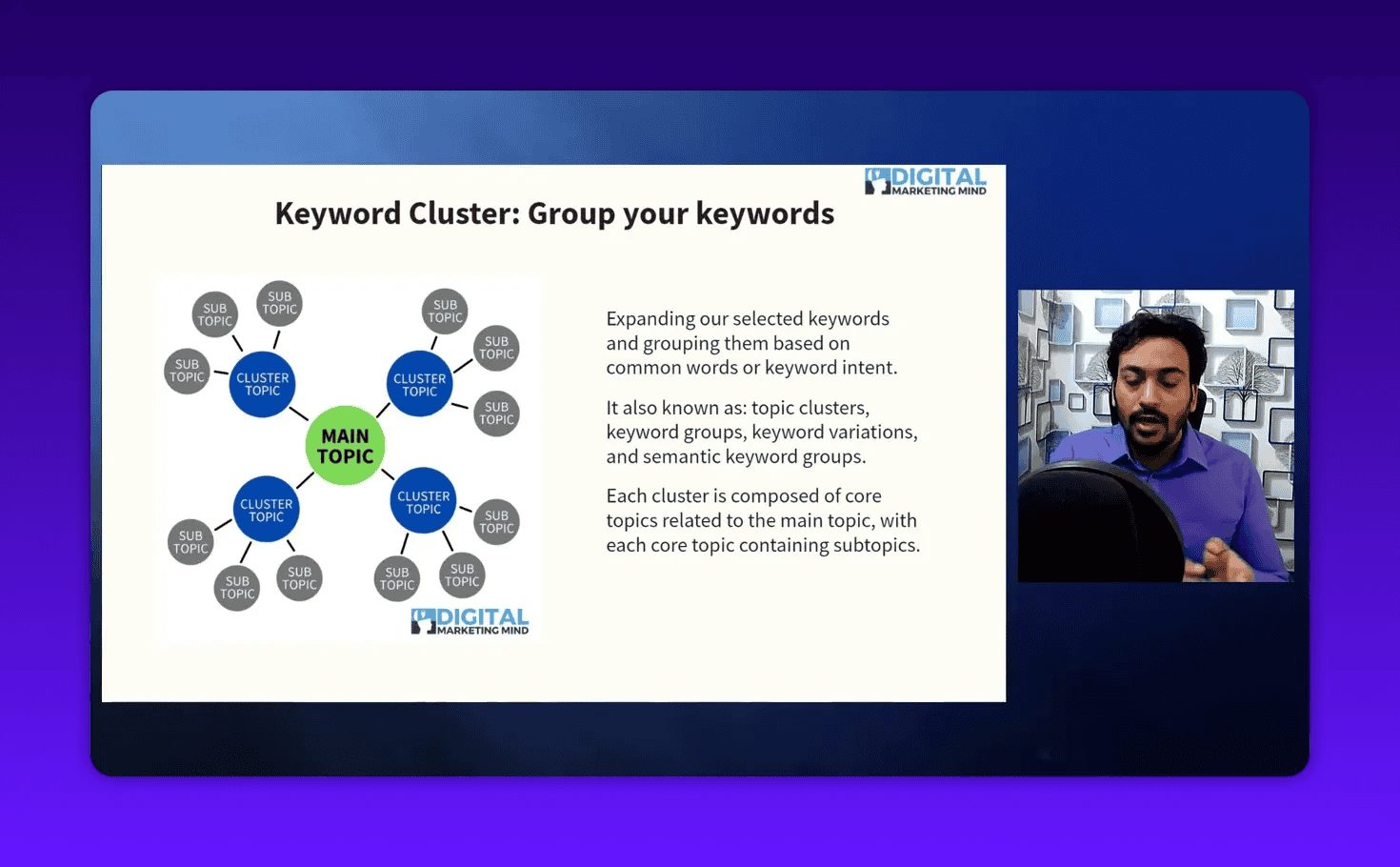 Clear presentation slide 'Keyword Cluster: Group your keywords' showing a central MAIN TOPIC linked to several cluster topics and subtopic bubbles; compact instructor inset to the right so the slide remains prominent.