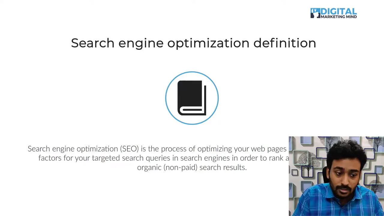 Presentation slide titled 'Search engine optimization definition' with book icon and readable definition text, small presenter inset in lower-right